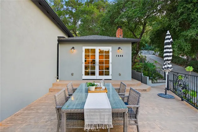 a sign that is sitting in front of flowers