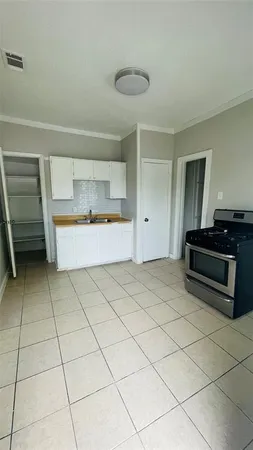 a view of kitchen with furniture and cabinets
