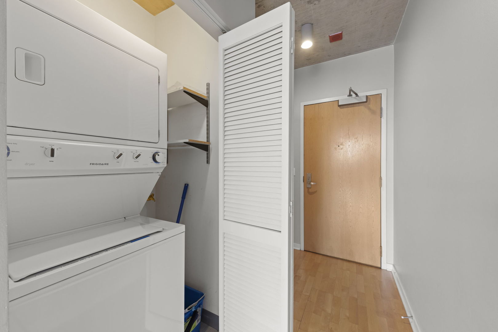 611 South Wells Street, Unit 2402 Chicago, IL 60607 - Photo 12 of 33 a utility room with dryer and washer