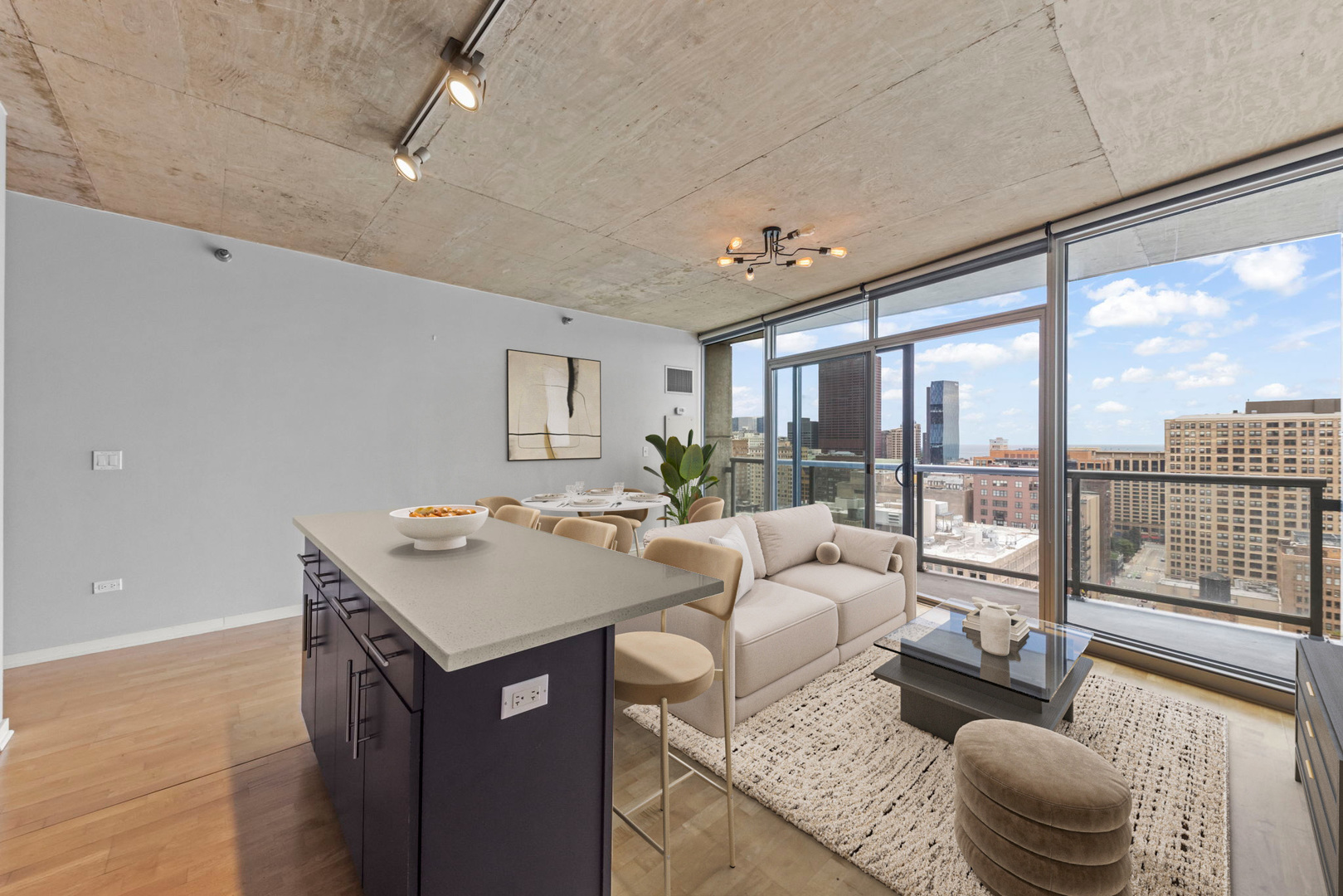 611 South Wells Street, Unit 2402 Chicago, IL 60607 - Photo 8 of 33 a living room with furniture and a floor to ceiling window