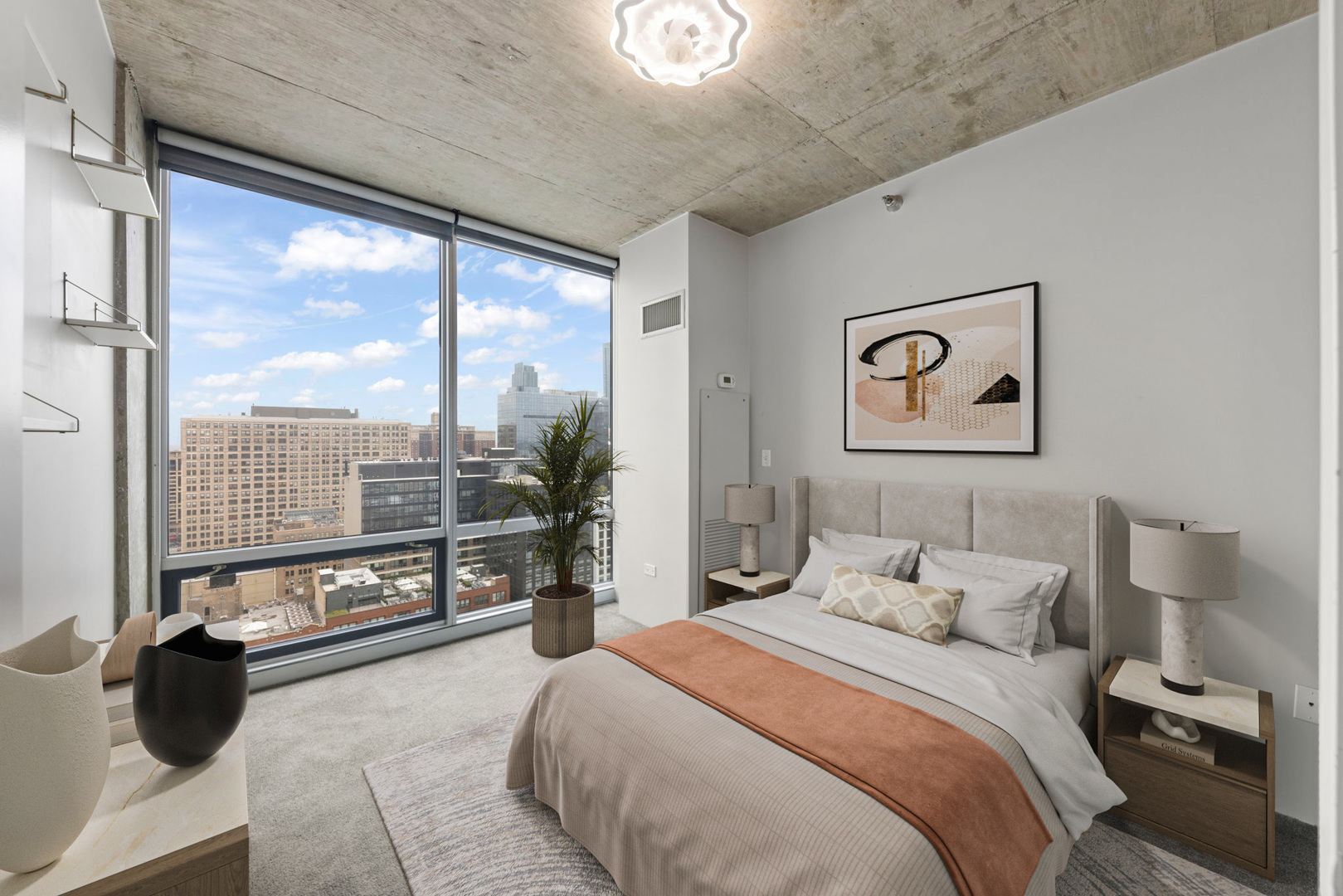 611 South Wells Street, Unit 2402 Chicago, IL 60607 - Photo 9 of 33 a bedroom with a large bed and a balcony view