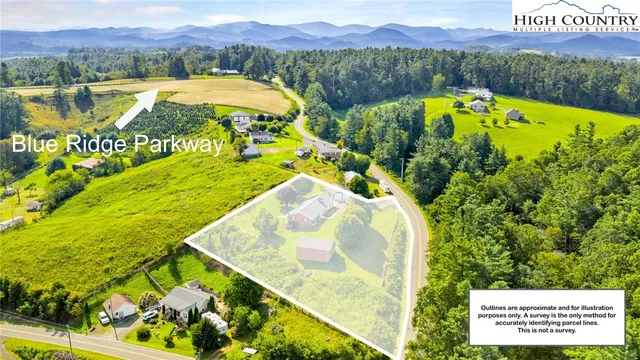 a view of an empty room with a fireplace and a large window