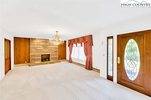 a large kitchen with stainless steel appliances granite countertop a sink and cabinets