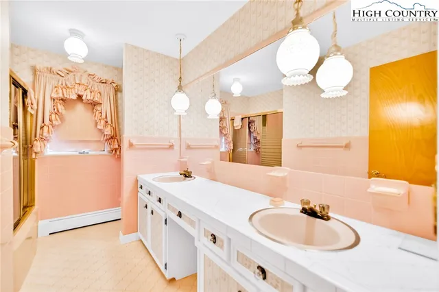 a bathroom with a sink and a mirror