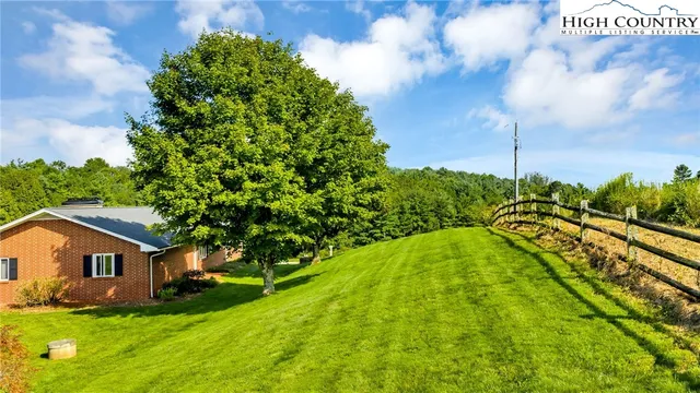 a blue house with yard in front of it