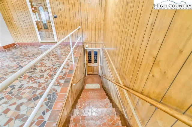 a view of kitchen with furniture and wooden floor