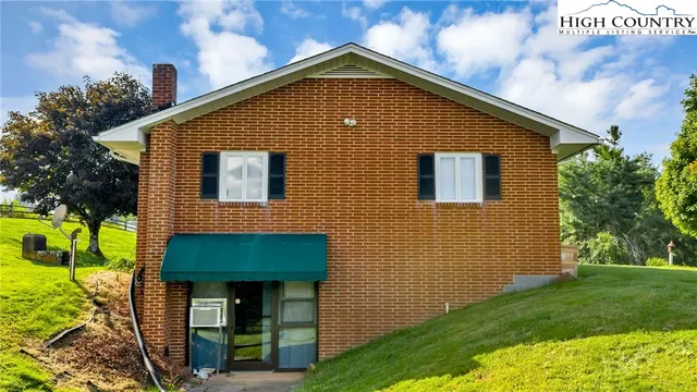 a view of kitchen with furniture and wooden floor