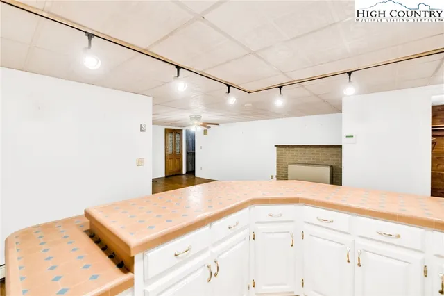 a kitchen with stainless steel appliances a sink and cabinets