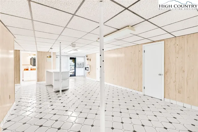 a bedroom with a bed and a plant