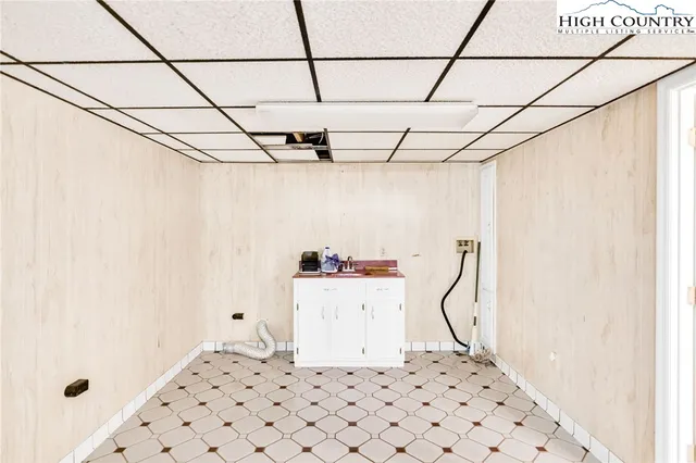 a view of a lush green hillside and a houses