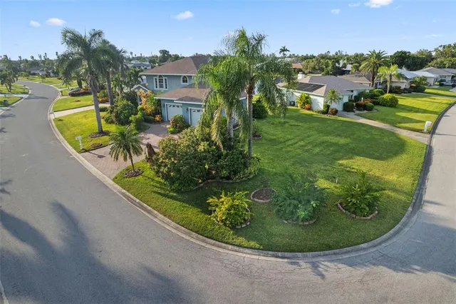 a view of a lake with houses in the back