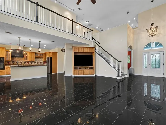 a lobby with furniture and floor to ceiling window