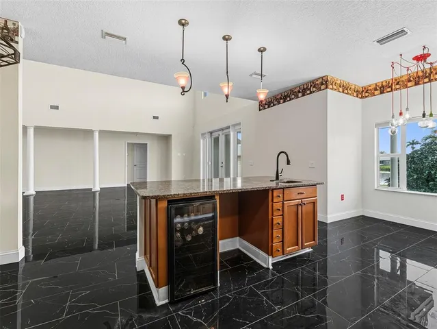 a view of a bathroom with sink and mirror