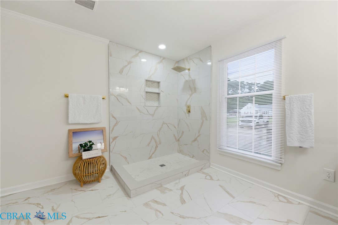 718 Dandy Loop Road Yorktown, VA 23692 - Photo 20 of 42 Full bathroom with ornamental molding, a marble finish shower, marble look tiles, and recessed lighting