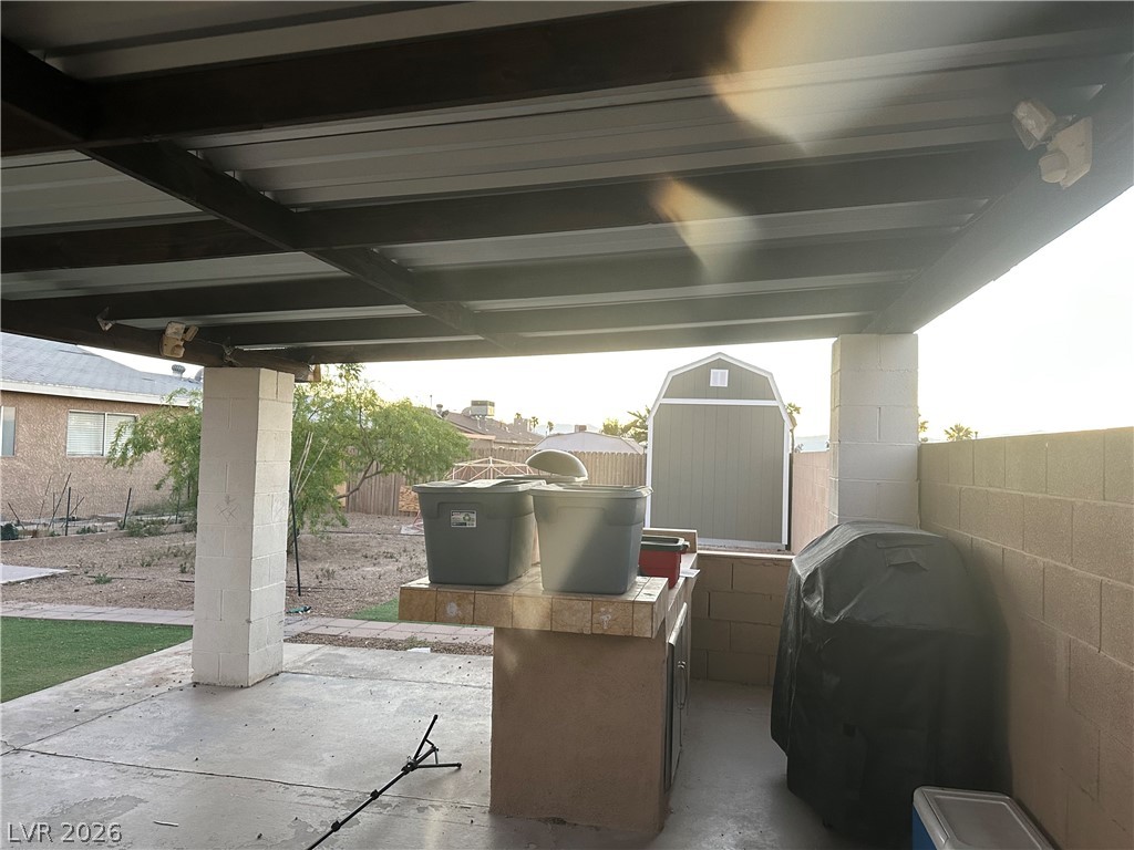 233 Ash Street Henderson, NV 89015 - Photo 17 of 20 Fenced backyard with a patio