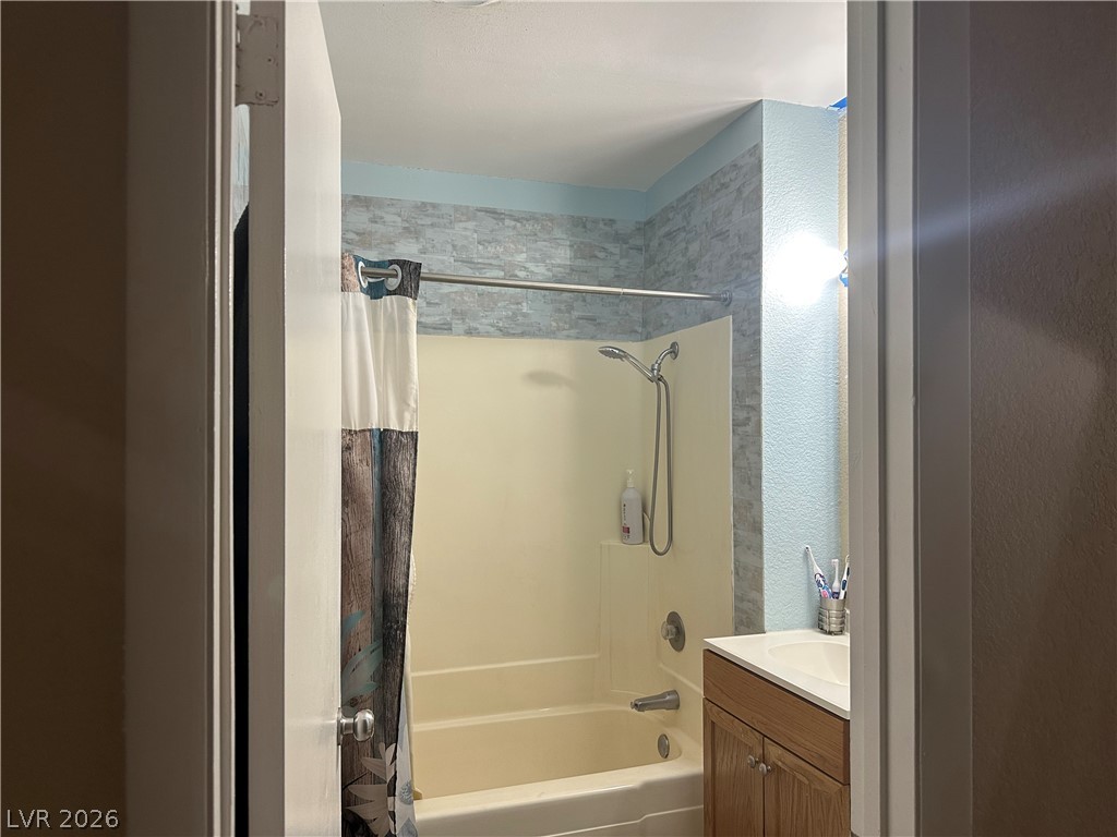 233 Ash Street Henderson, NV 89015 - Photo 8 of 20 Full bathroom with vanity and shower / bath combination with curtain