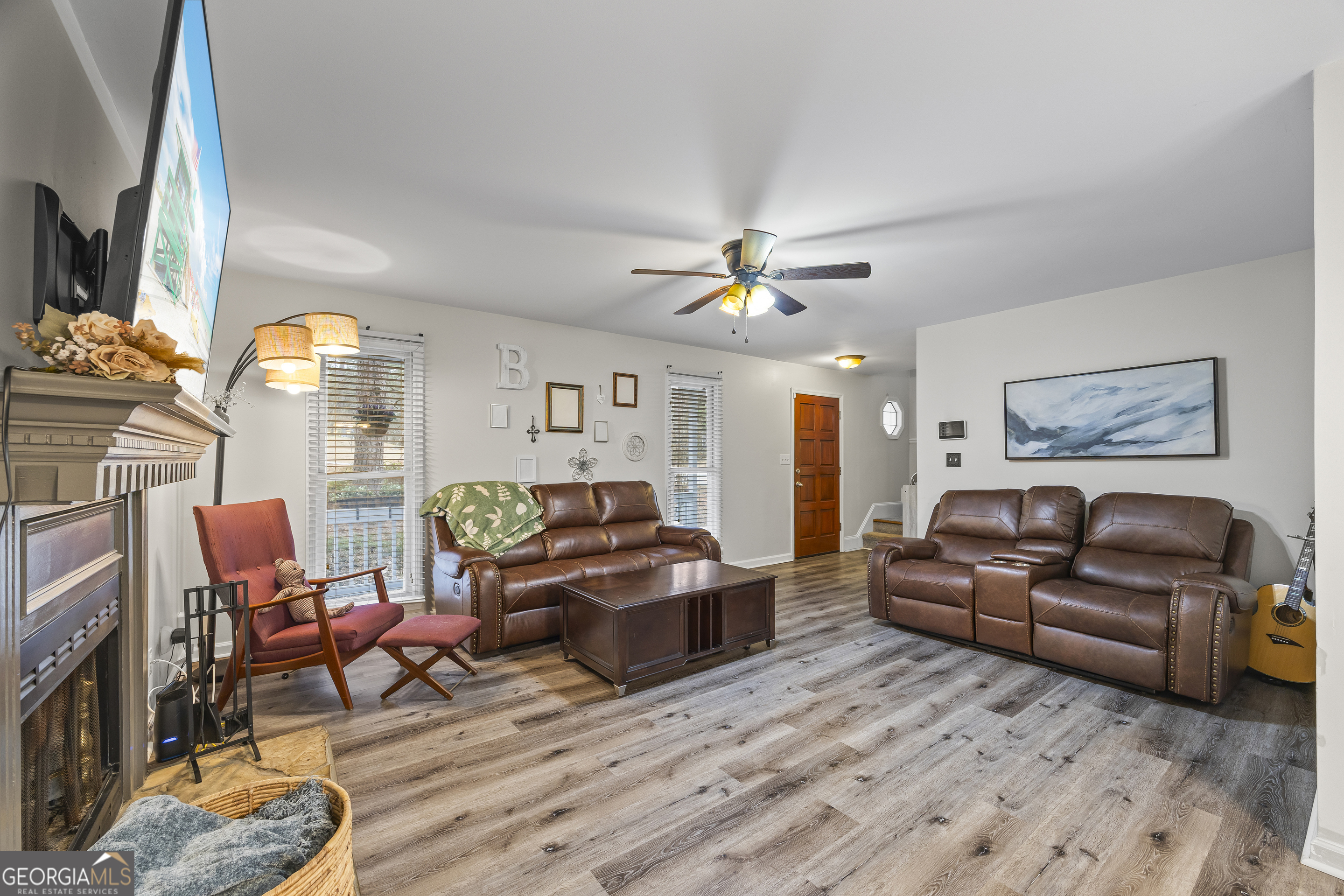 129 Pheasant Run Bogart, GA 30622 - Photo 12 of 50 a living room with furniture and a chandelier