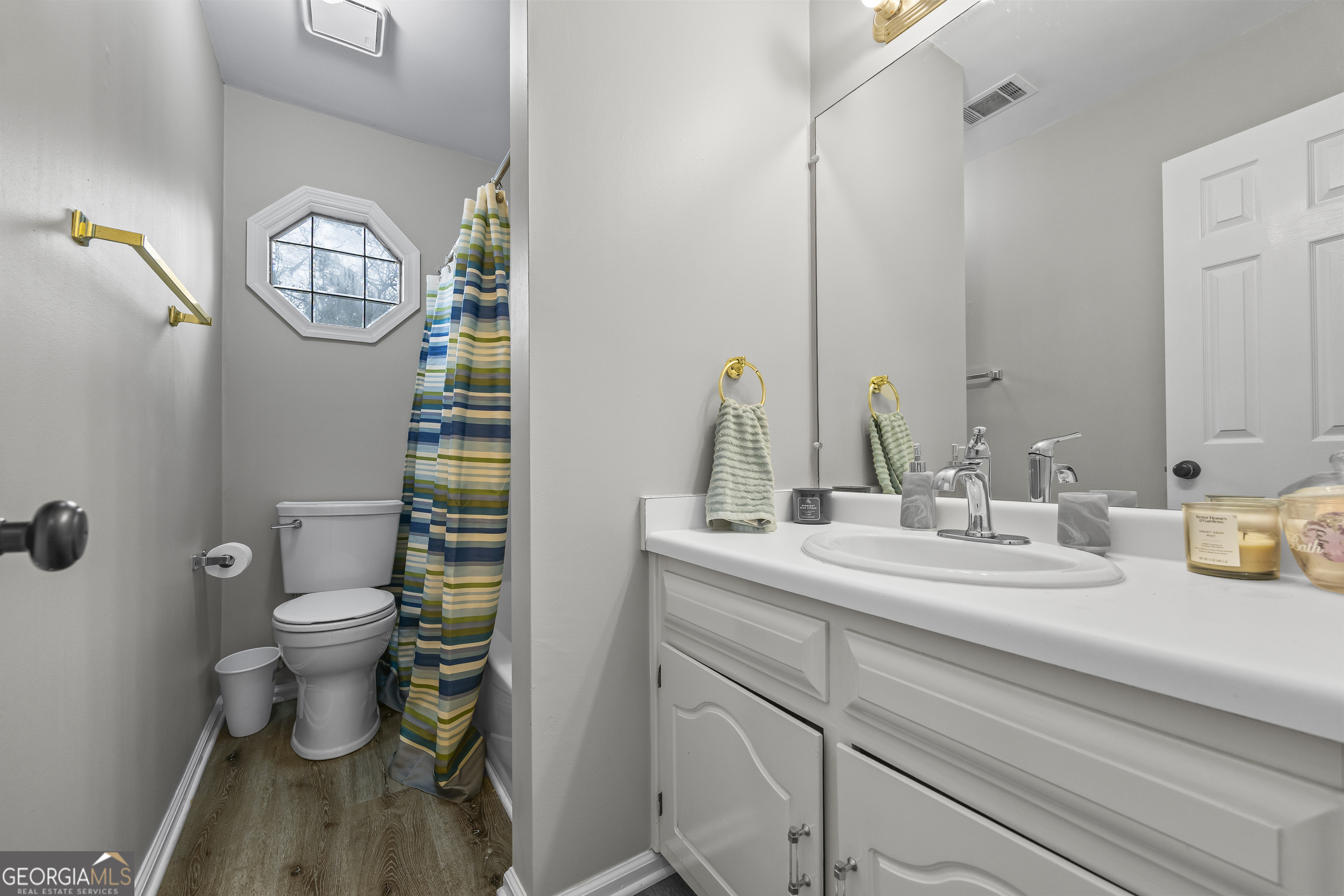 129 Pheasant Run Bogart, GA 30622 - Photo 28 of 50 a bathroom with a sink a toilet and a mirror