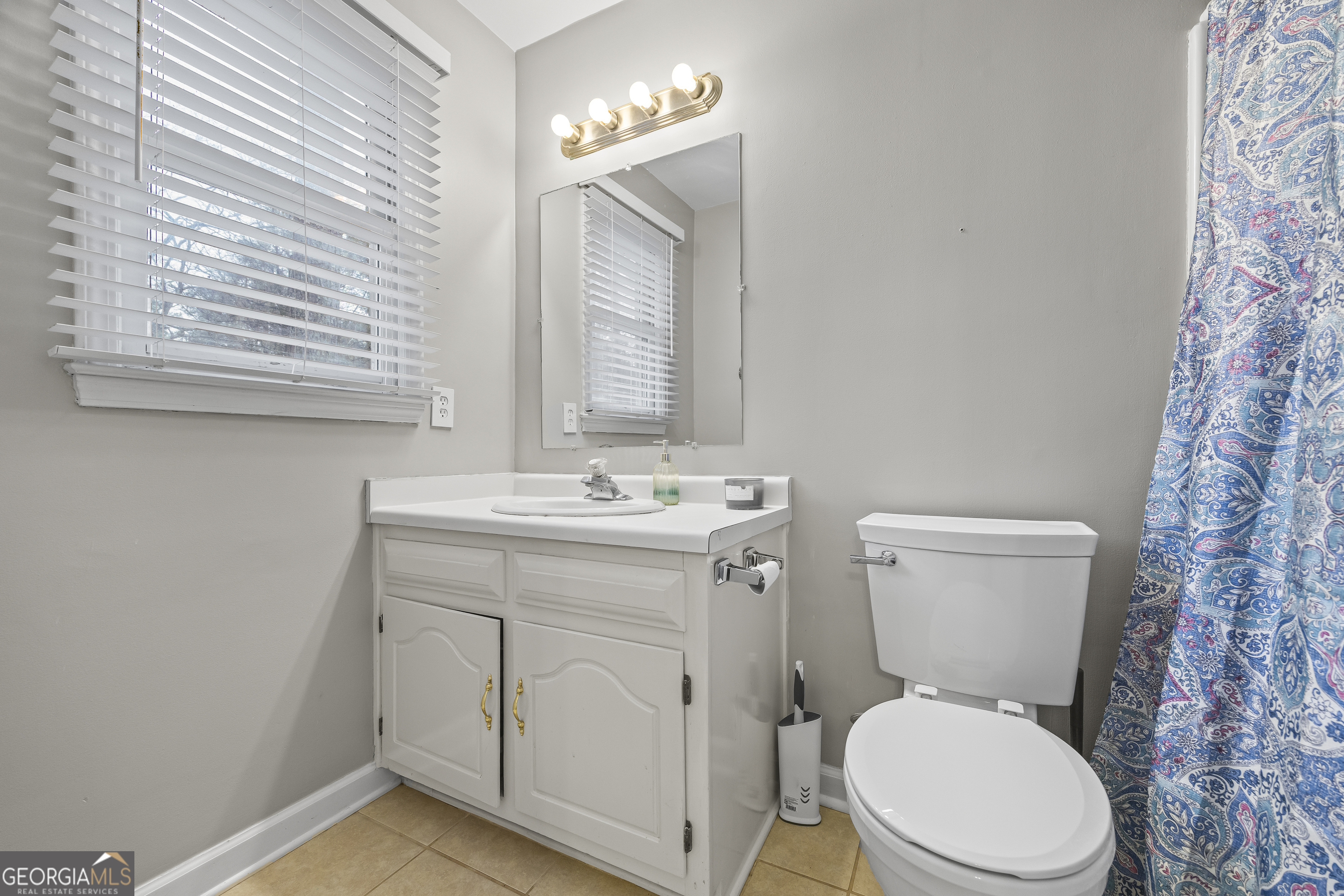 129 Pheasant Run Bogart, GA 30622 - Photo 29 of 50 a bathroom with a toilet sink and mirror