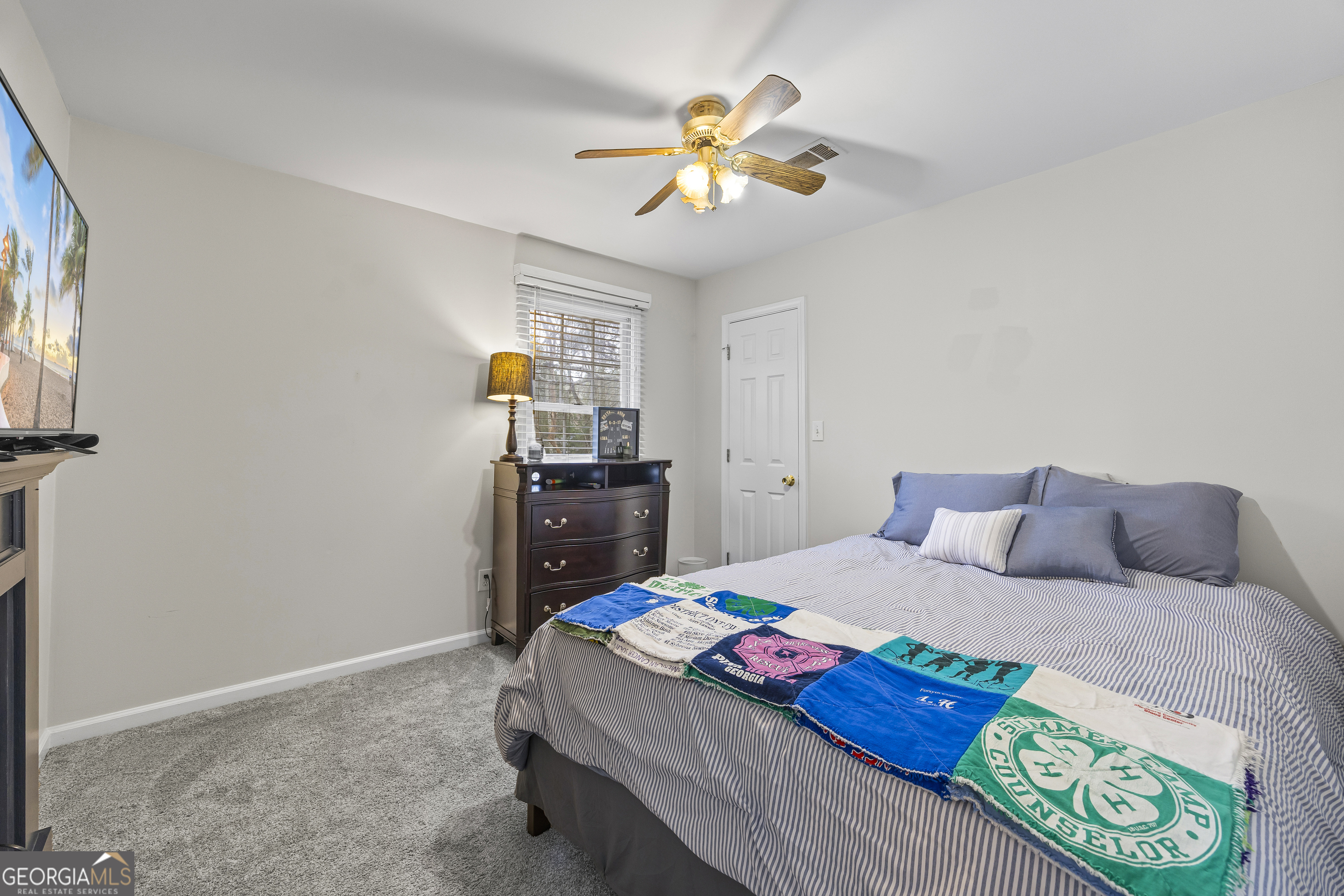 129 Pheasant Run Bogart, GA 30622 - Photo 35 of 50 a bedroom with a bed and a chandelier