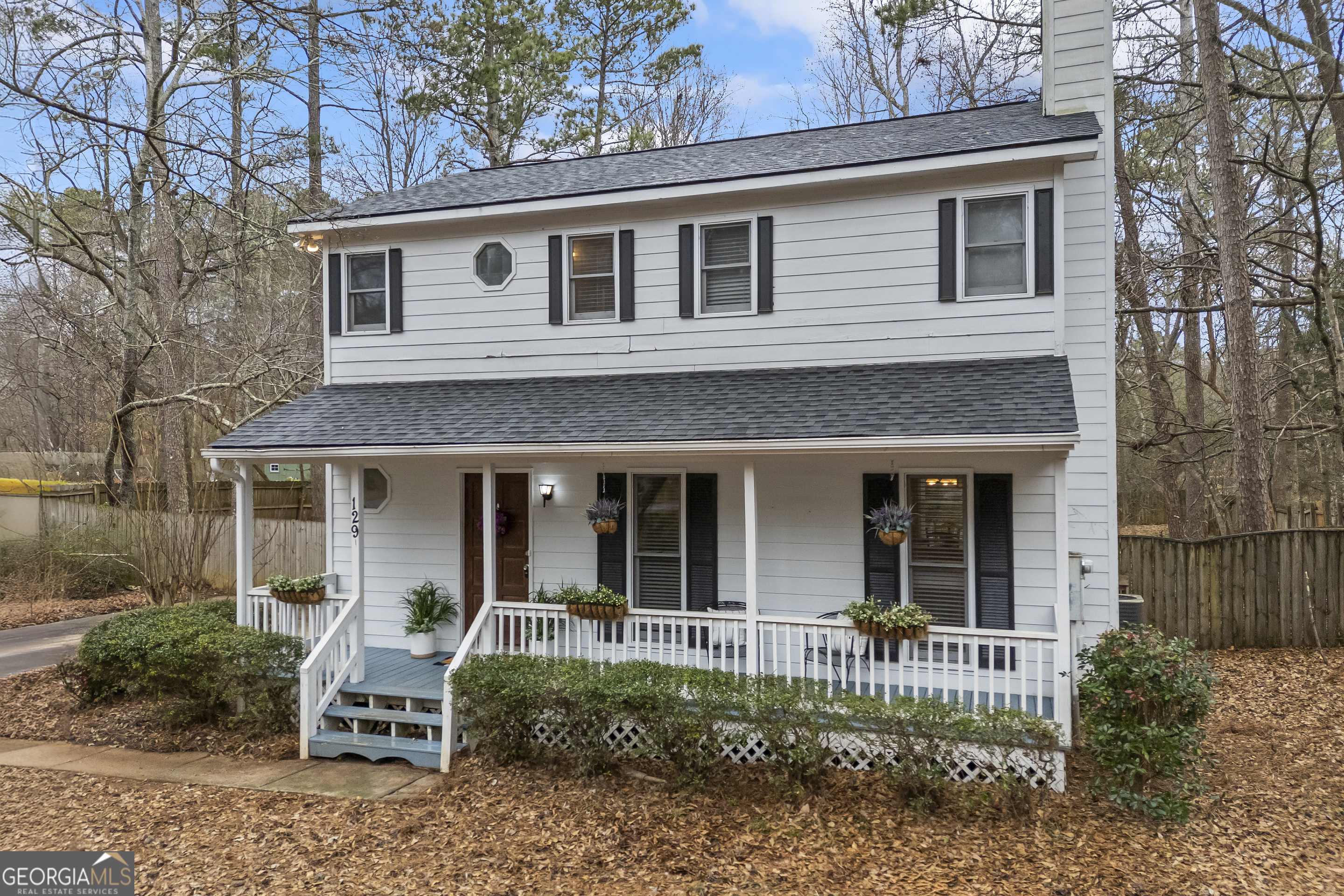 129 Pheasant Run Bogart, GA 30622 - Photo 4 of 50 a front view of a house with a garden