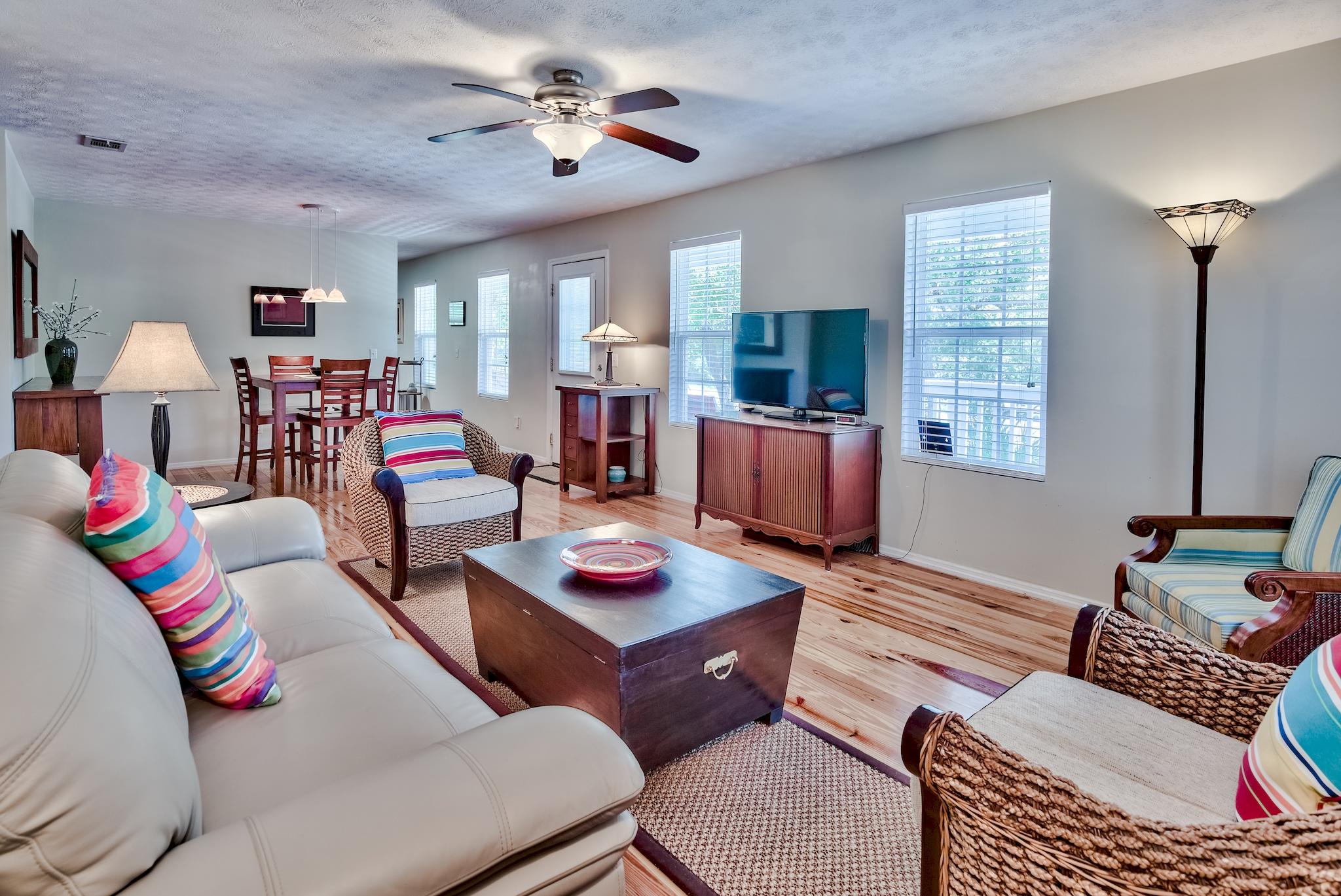 197 Acacia Street Santa Rosa Beach, FL 32459 - Photo 13 of 40 a living room with furniture fireplace and a window