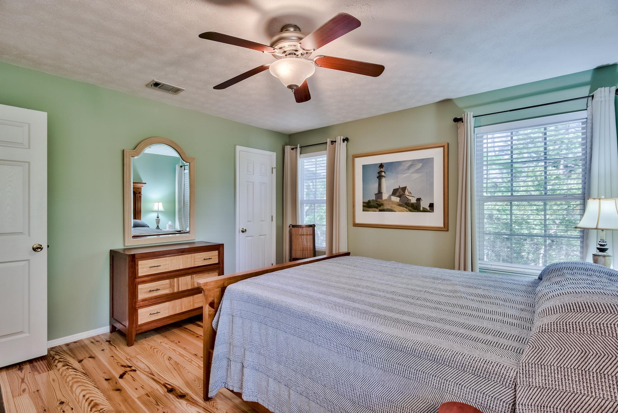 197 Acacia Street Santa Rosa Beach, FL 32459 - Photo 17 of 40 a bedroom with a bed and a large window