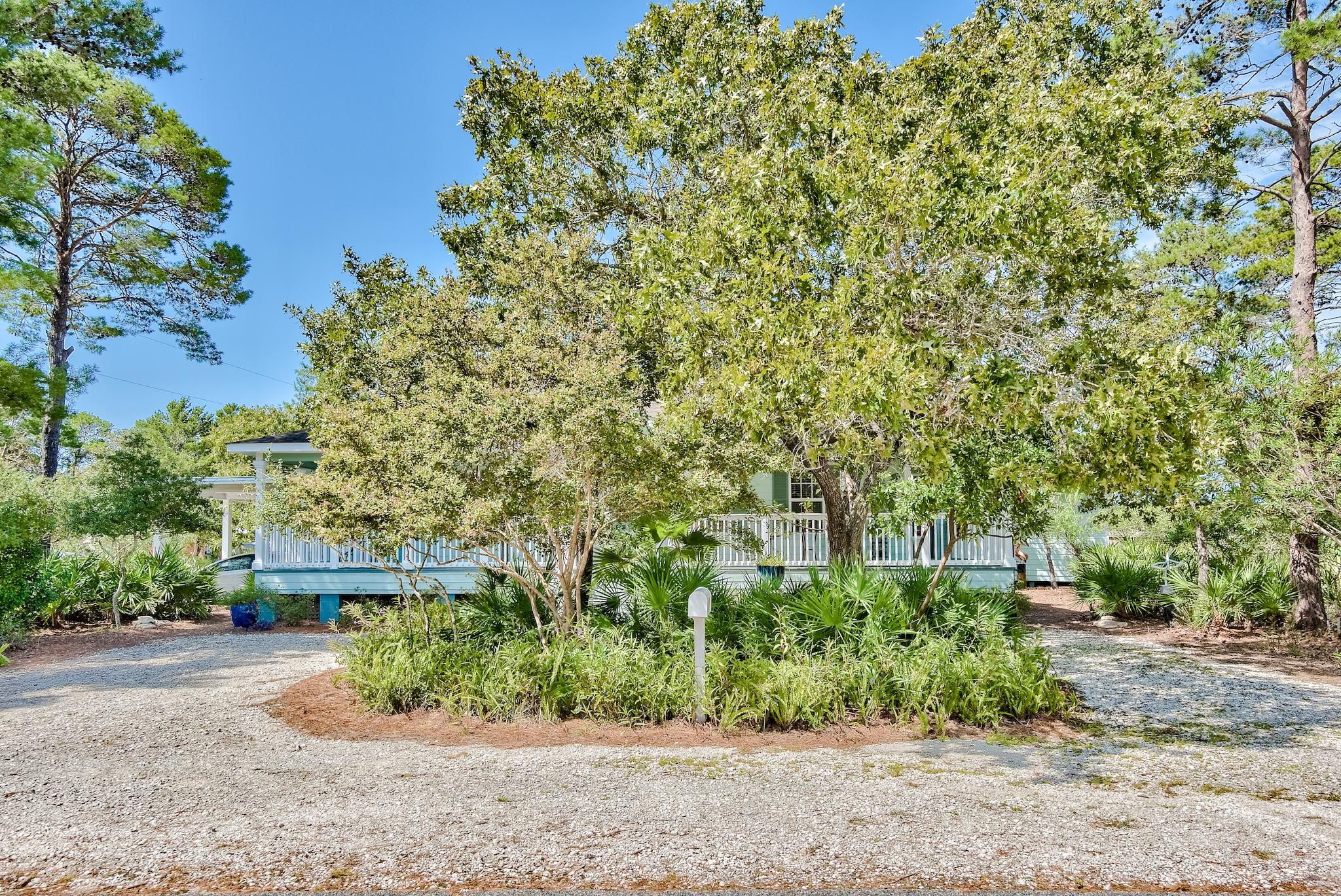 197 Acacia Street Santa Rosa Beach, FL 32459 - Photo 2 of 40 front view of a house with a tree