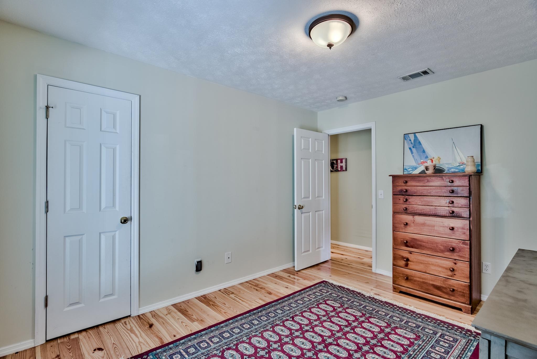 197 Acacia Street Santa Rosa Beach, FL 32459 - Photo 21 of 40 a view of room with stairs and furniture