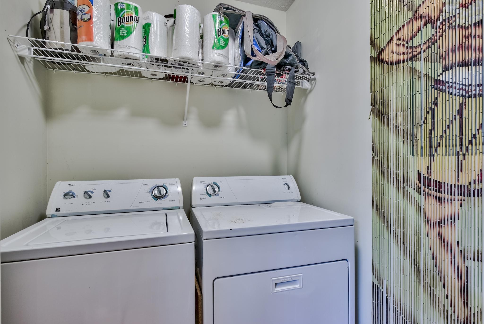 197 Acacia Street Santa Rosa Beach, FL 32459 - Photo 26 of 40 a view of storage and utility room with washer and dryer