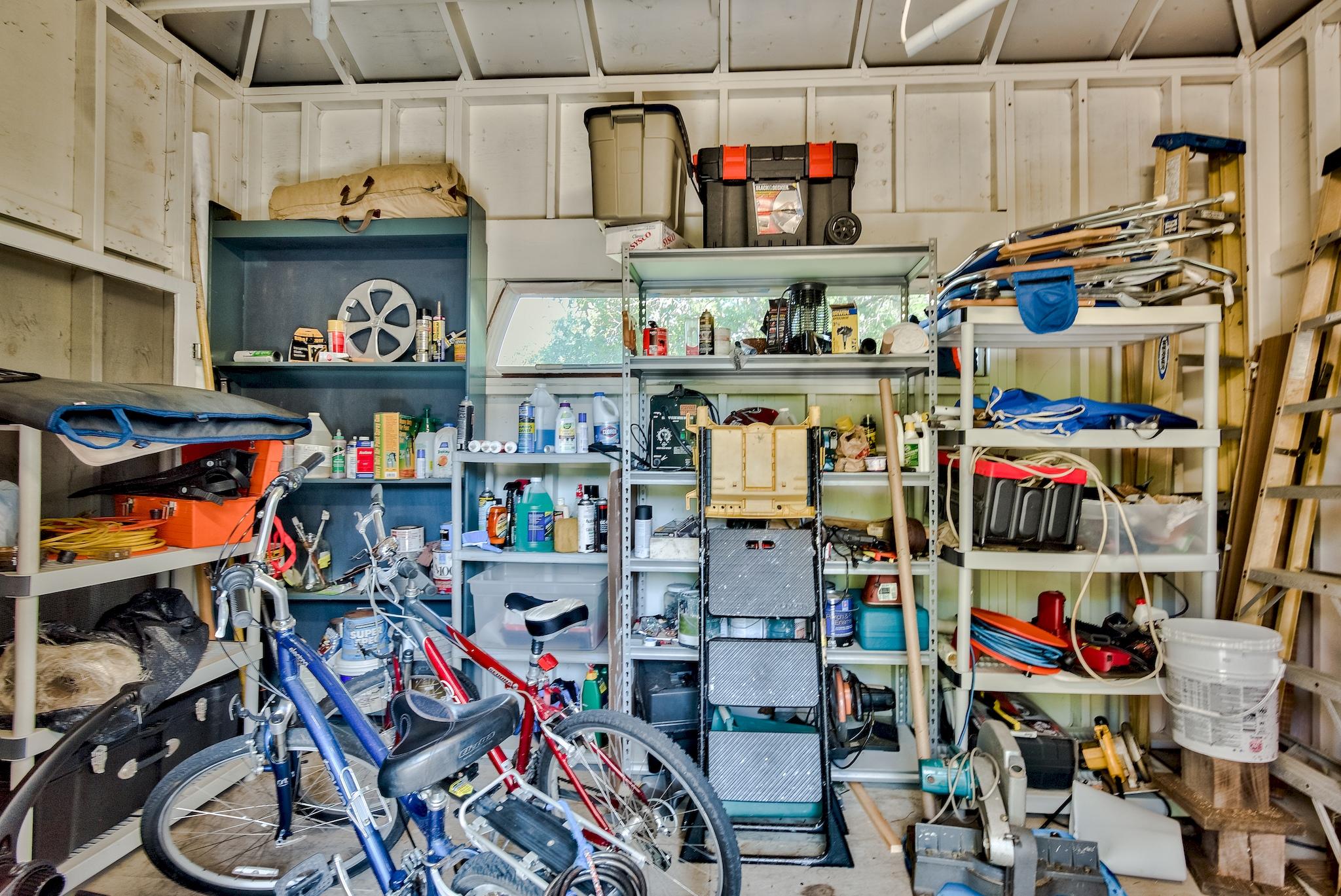 197 Acacia Street Santa Rosa Beach, FL 32459 - Photo 27 of 40 a store room with lots of clutter and bicycles