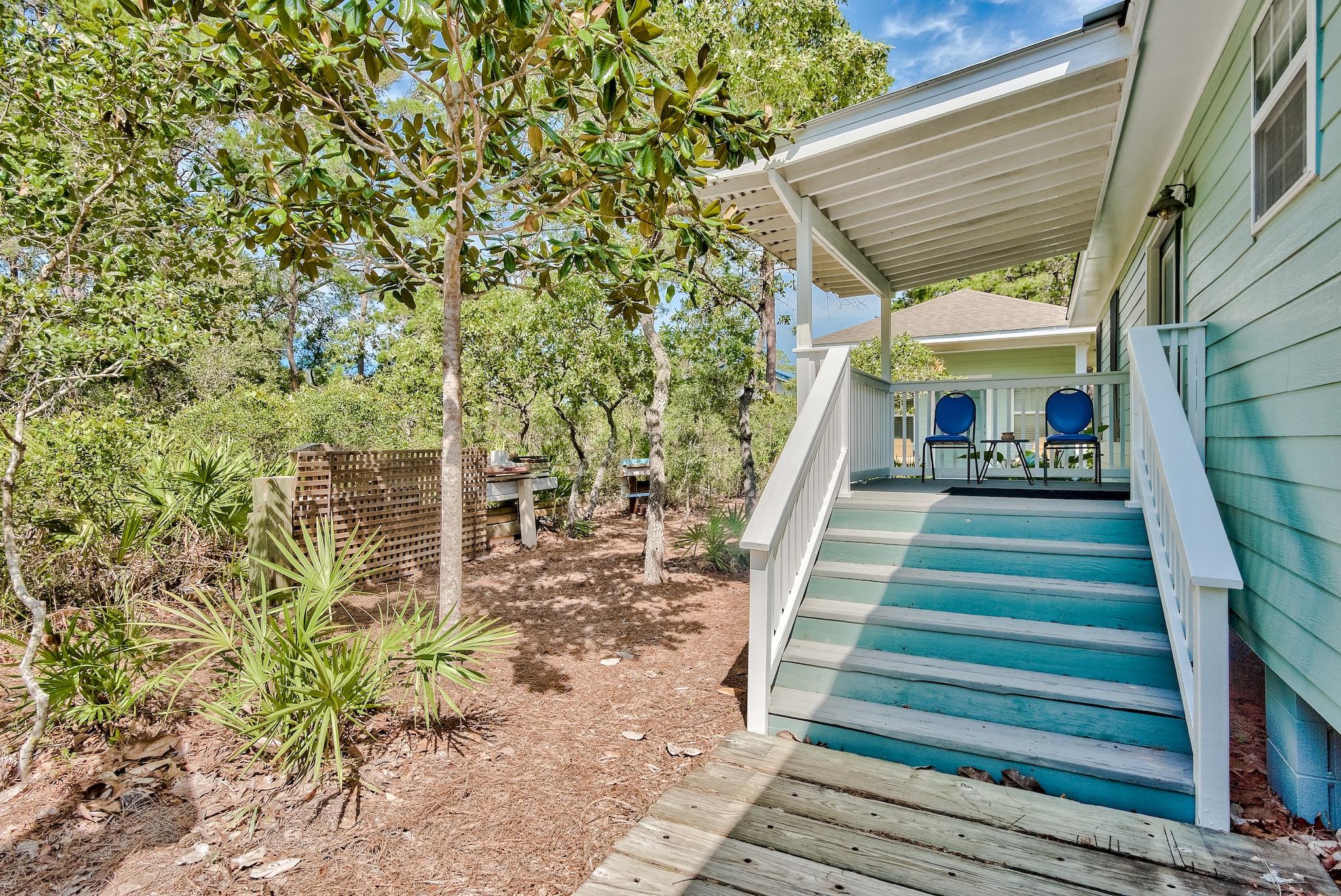 197 Acacia Street Santa Rosa Beach, FL 32459 - Photo 29 of 40 a view of a house with a yard