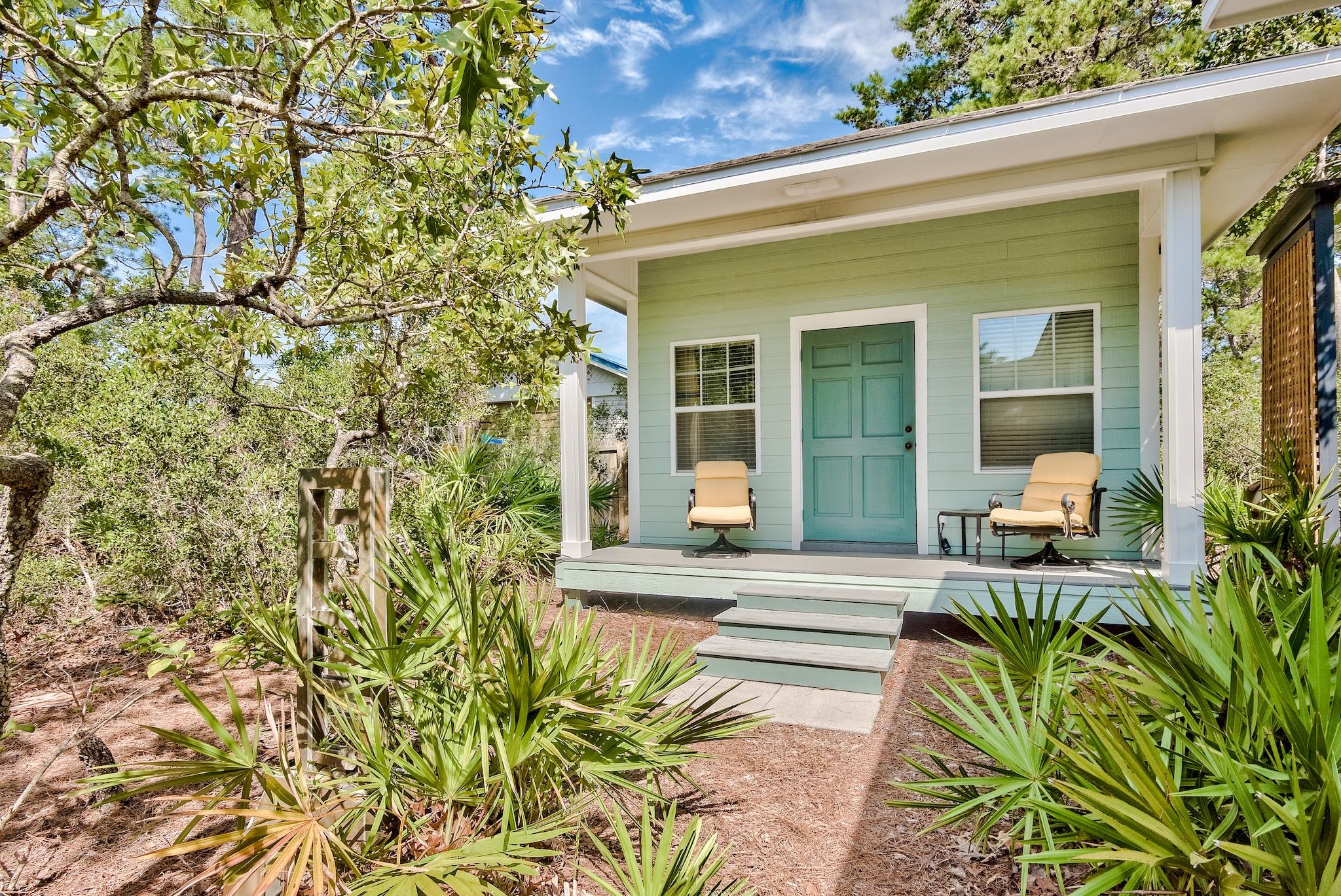 197 Acacia Street Santa Rosa Beach, FL 32459 - Photo 3 of 40 a view of house with backyard and porch