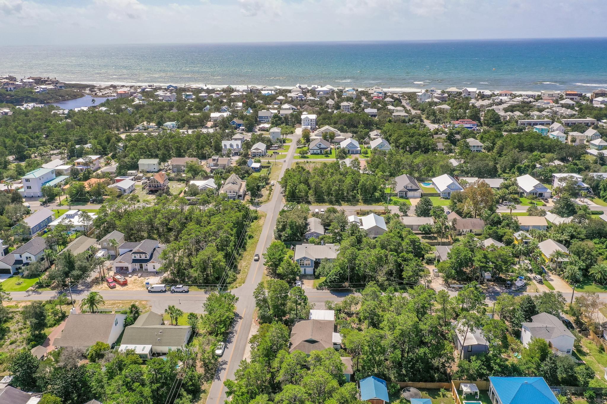 197 Acacia Street Santa Rosa Beach, FL 32459 - Photo 39 of 40 an aerial view of residential building with parking space