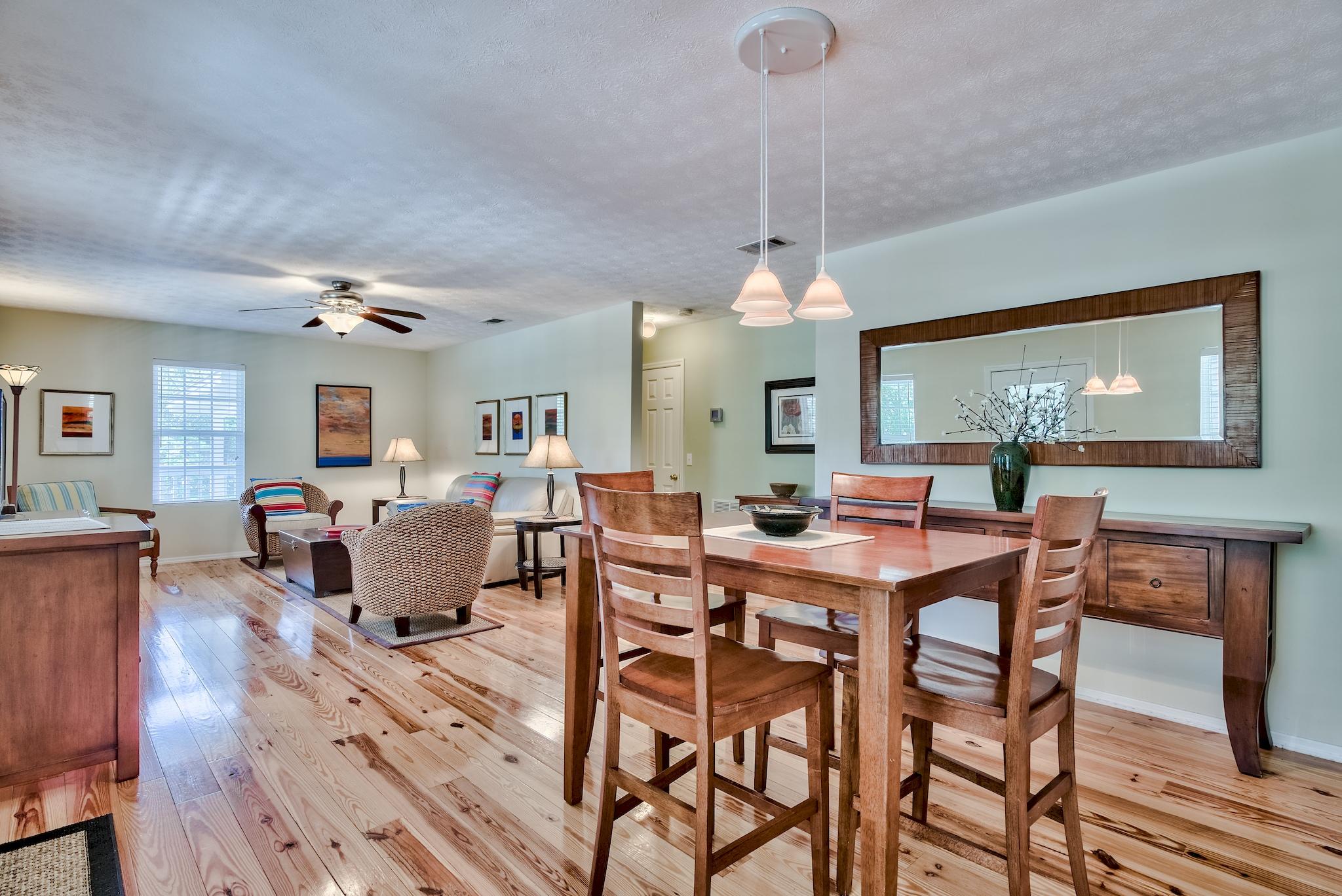 197 Acacia Street Santa Rosa Beach, FL 32459 - Photo 8 of 40 a view of a dining room with furniture window and wooden floor