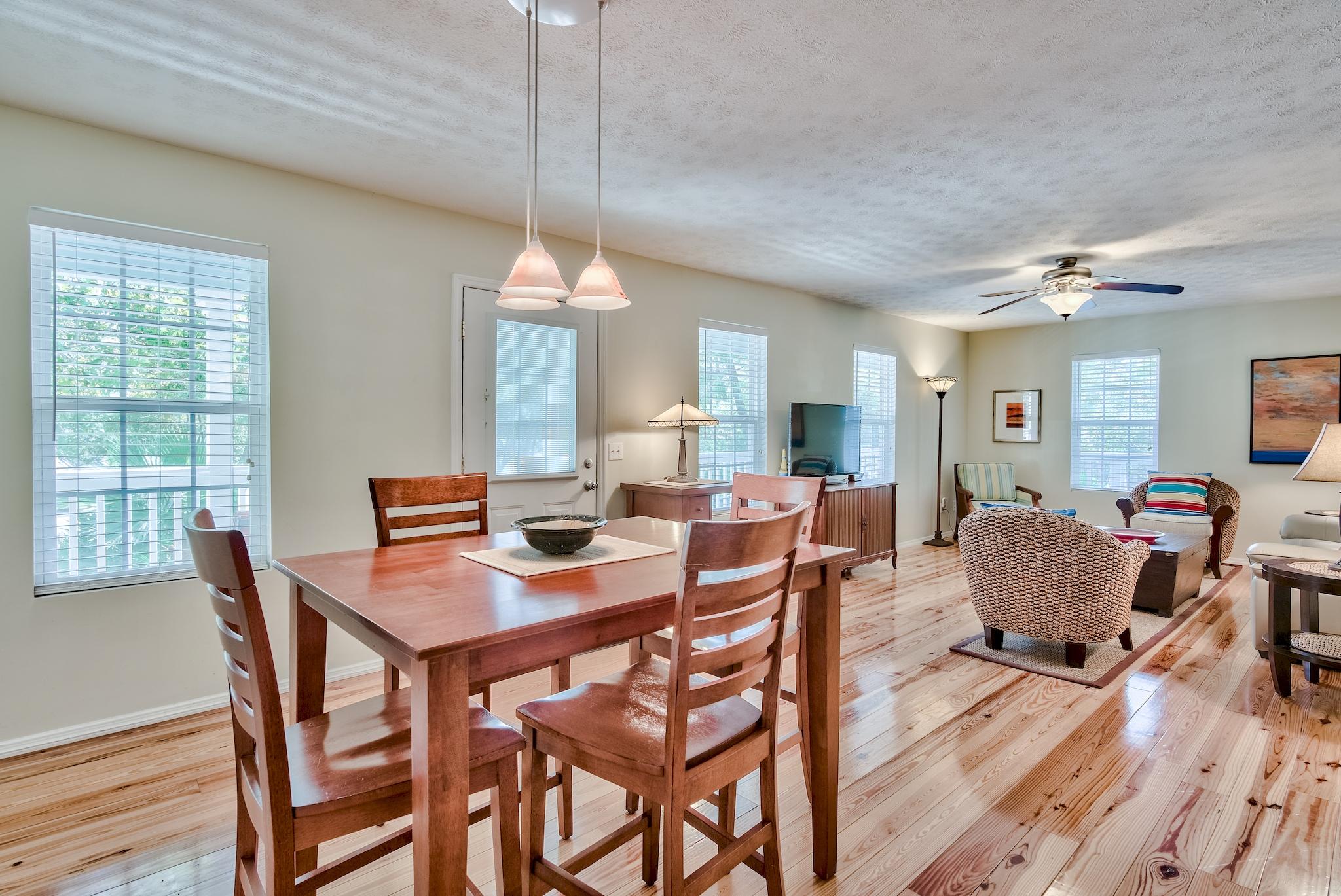 197 Acacia Street Santa Rosa Beach, FL 32459 - Photo 9 of 40 a view of a dining room with furniture window and wooden floor