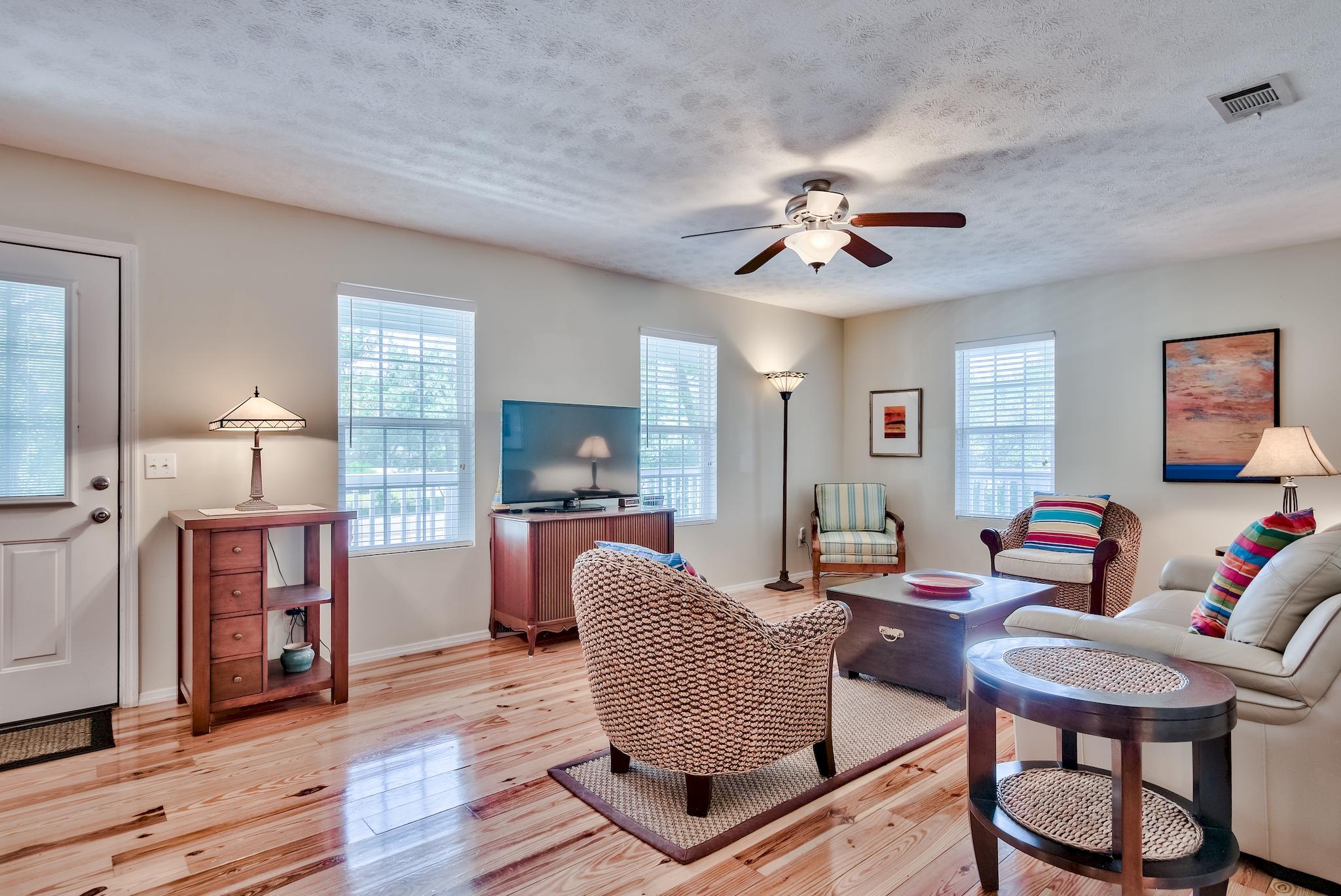 197 Acacia Street Santa Rosa Beach, FL 32459 - Photo 10 of 40 a living room with furniture and a flat screen tv