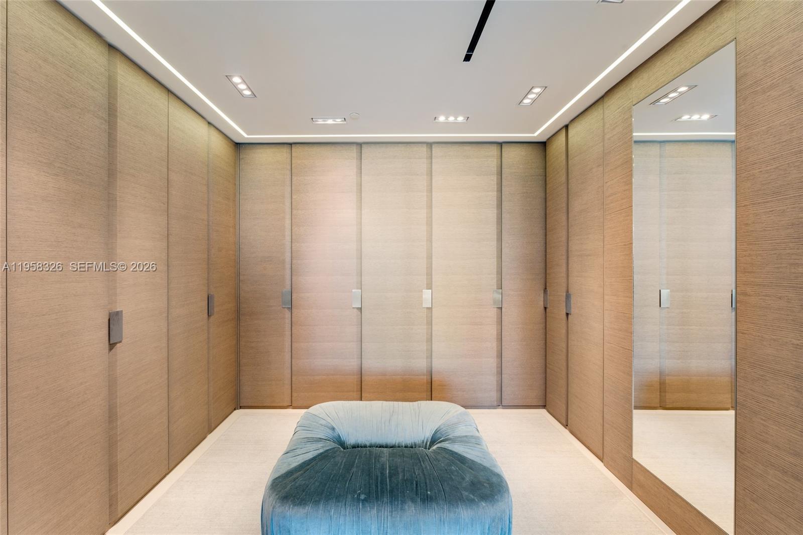 350 Ocean Drive, Unit 701N Key Biscayne, FL 33149 - Photo 12 of 52 a bedroom with a large bed and a chandelier