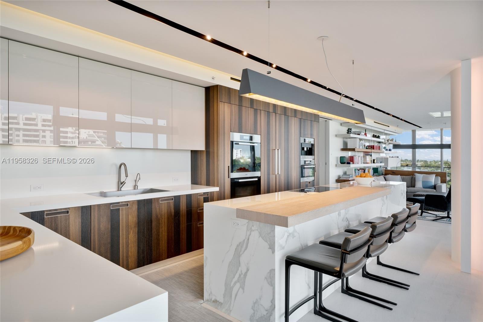 350 Ocean Drive, Unit 701N Key Biscayne, FL 33149 - Photo 17 of 52 a kitchen with stainless steel appliances granite countertop a sink and a refrigerator