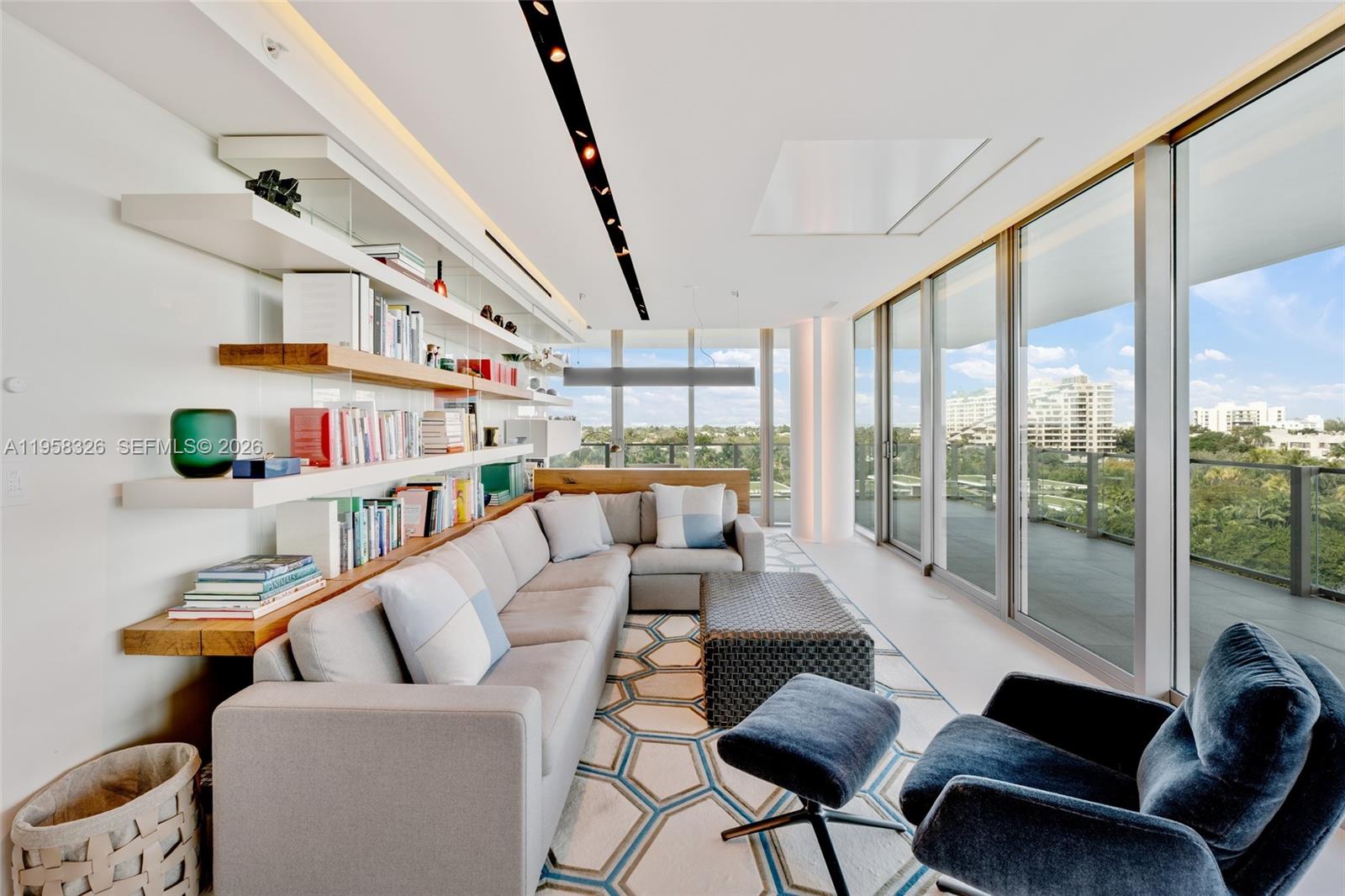 350 Ocean Drive, Unit 701N Key Biscayne, FL 33149 - Photo 19 of 52 a living room with furniture and a large window