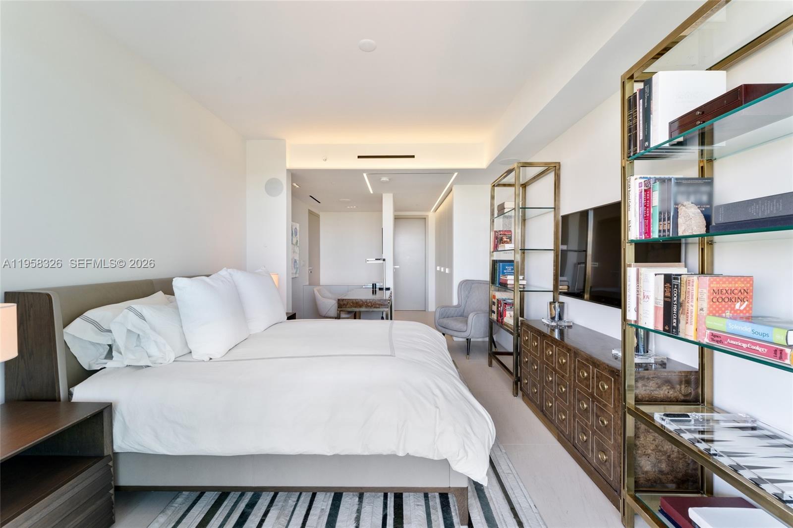 350 Ocean Drive, Unit 701N Key Biscayne, FL 33149 - Photo 30 of 52 a bed room with a bed and a couch