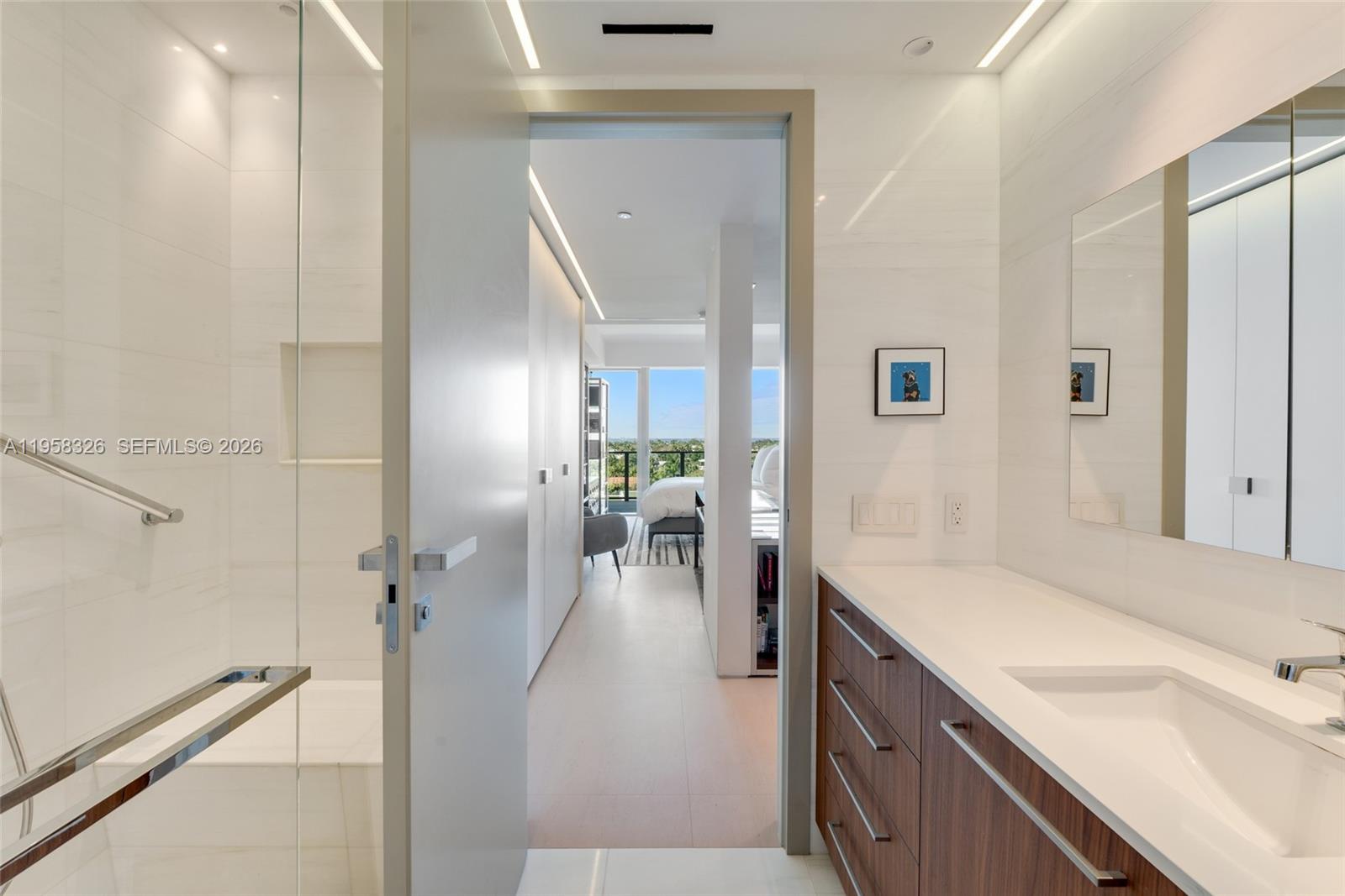 350 Ocean Drive, Unit 701N Key Biscayne, FL 33149 - Photo 31 of 52 a spacious bathroom with a sink and a mirror