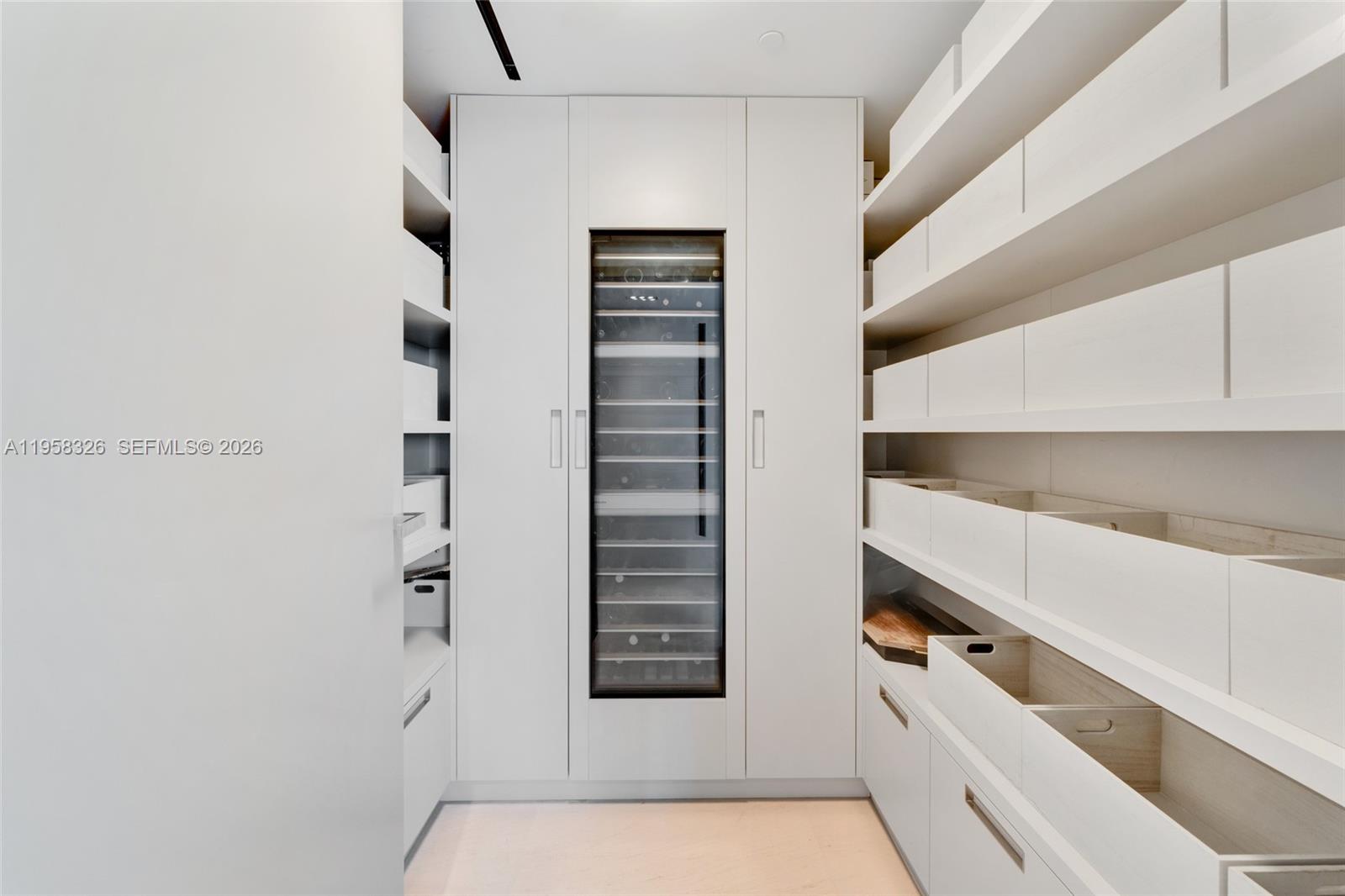 350 Ocean Drive, Unit 701N Key Biscayne, FL 33149 - Photo 33 of 52 a view of walk in closet with empty racks