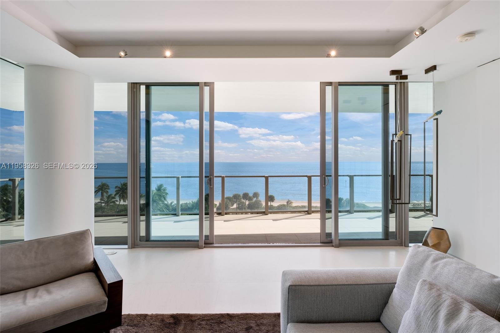 350 Ocean Drive, Unit 701N Key Biscayne, FL 33149 - Photo 39 of 52 a living room with furniture and a large window