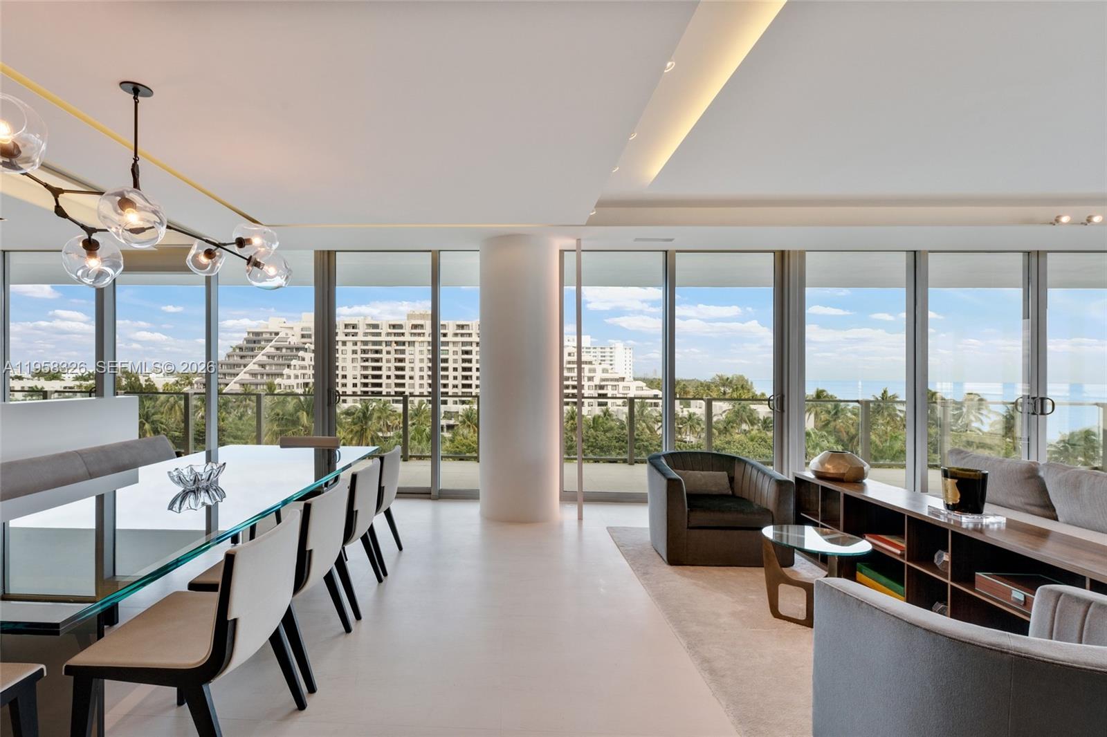 350 Ocean Drive, Unit 701N Key Biscayne, FL 33149 - Photo 5 of 52 a living room with furniture and floor to ceiling windows
