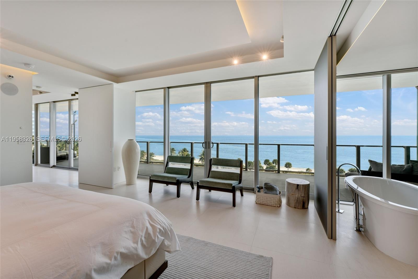 350 Ocean Drive, Unit 701N Key Biscayne, FL 33149 - Photo 7 of 52 a spacious bedroom with a large window and a table