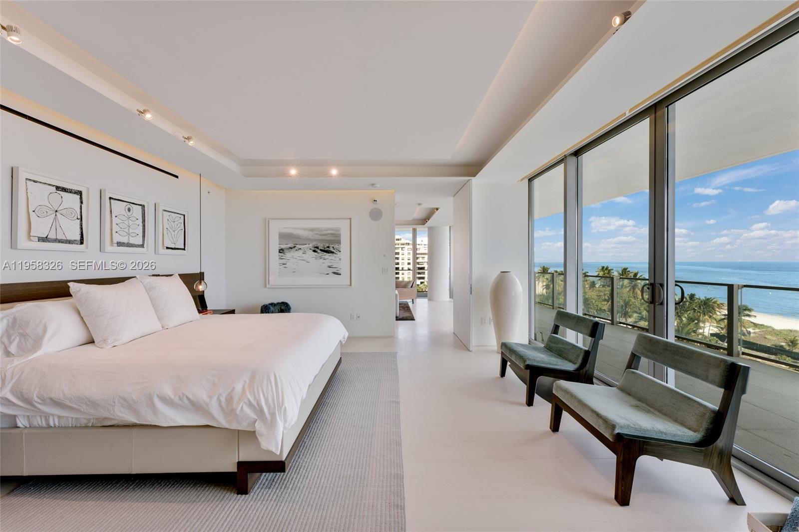 350 Ocean Drive, Unit 701N Key Biscayne, FL 33149 - Photo 8 of 52 a spacious bedroom with a bed and a large window