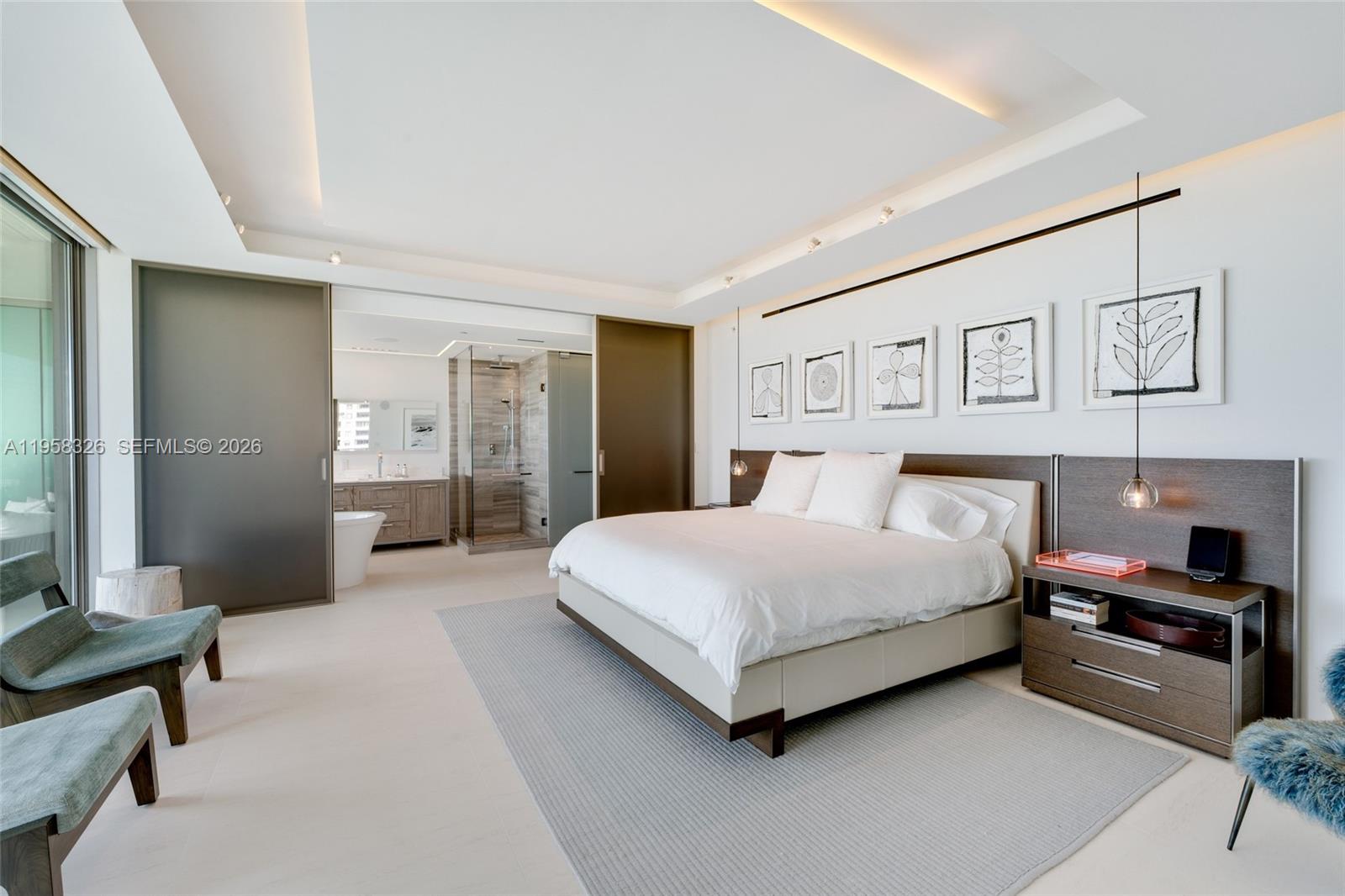 350 Ocean Drive, Unit 701N Key Biscayne, FL 33149 - Photo 9 of 52 a spacious bedroom with a bed and a couch