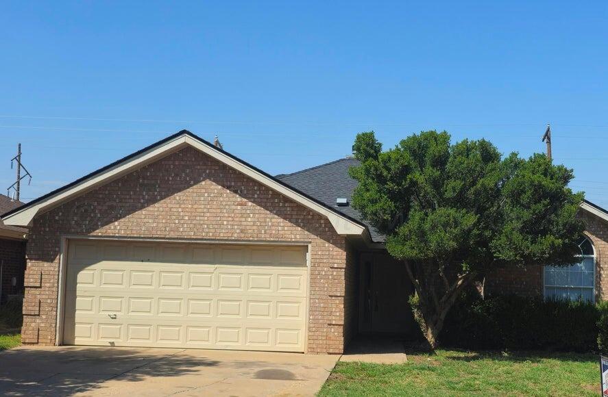 1918 75th Street Lubbock, TX 79423 - Photo 14 of 14 a front view of a house with a yard