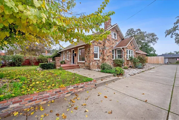 front view of a house with a yard